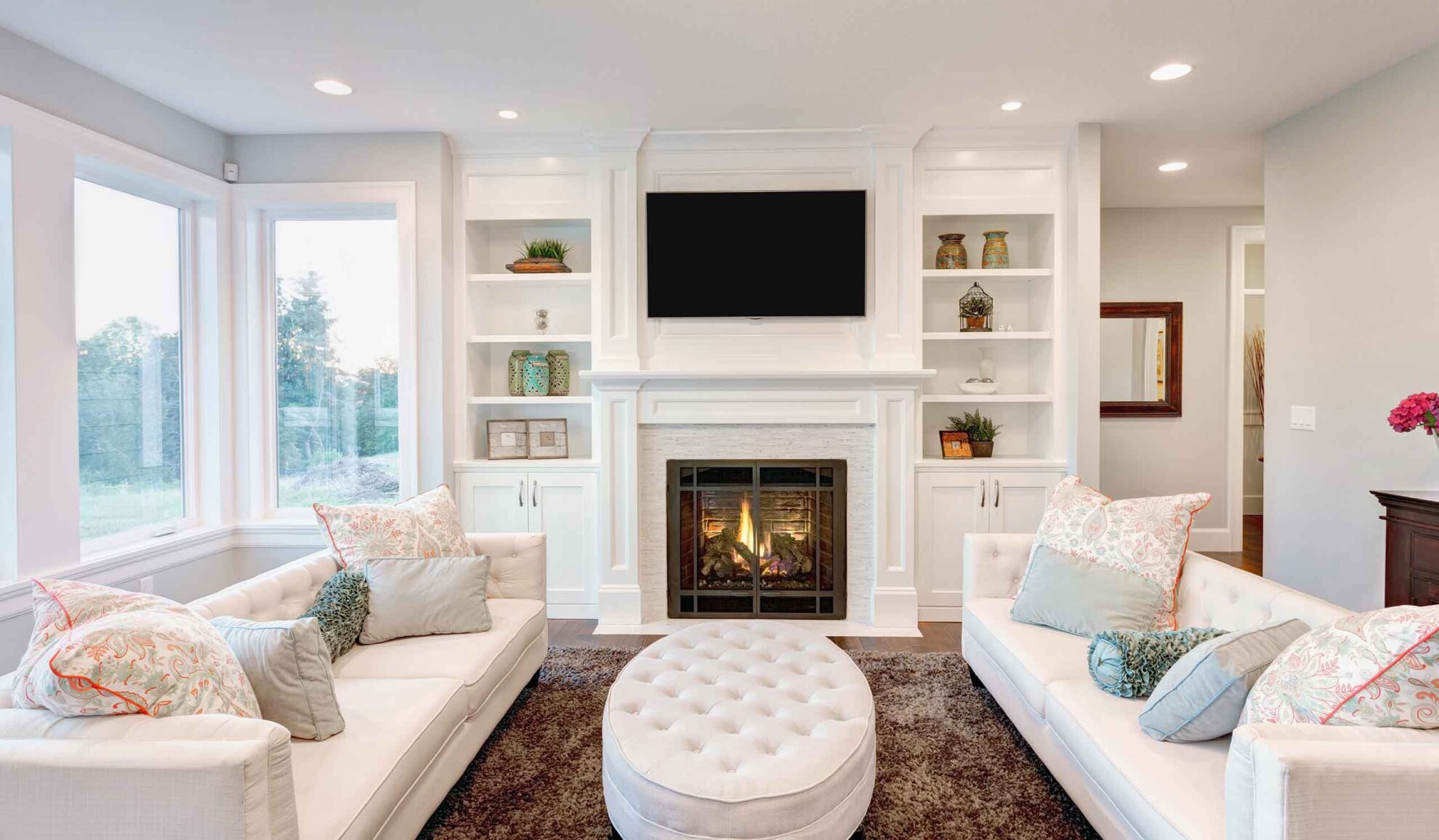 cozy living room with white sofa and fireplace centennial co